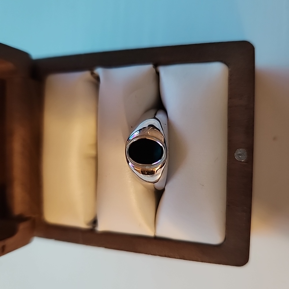 Silver ring with black stone